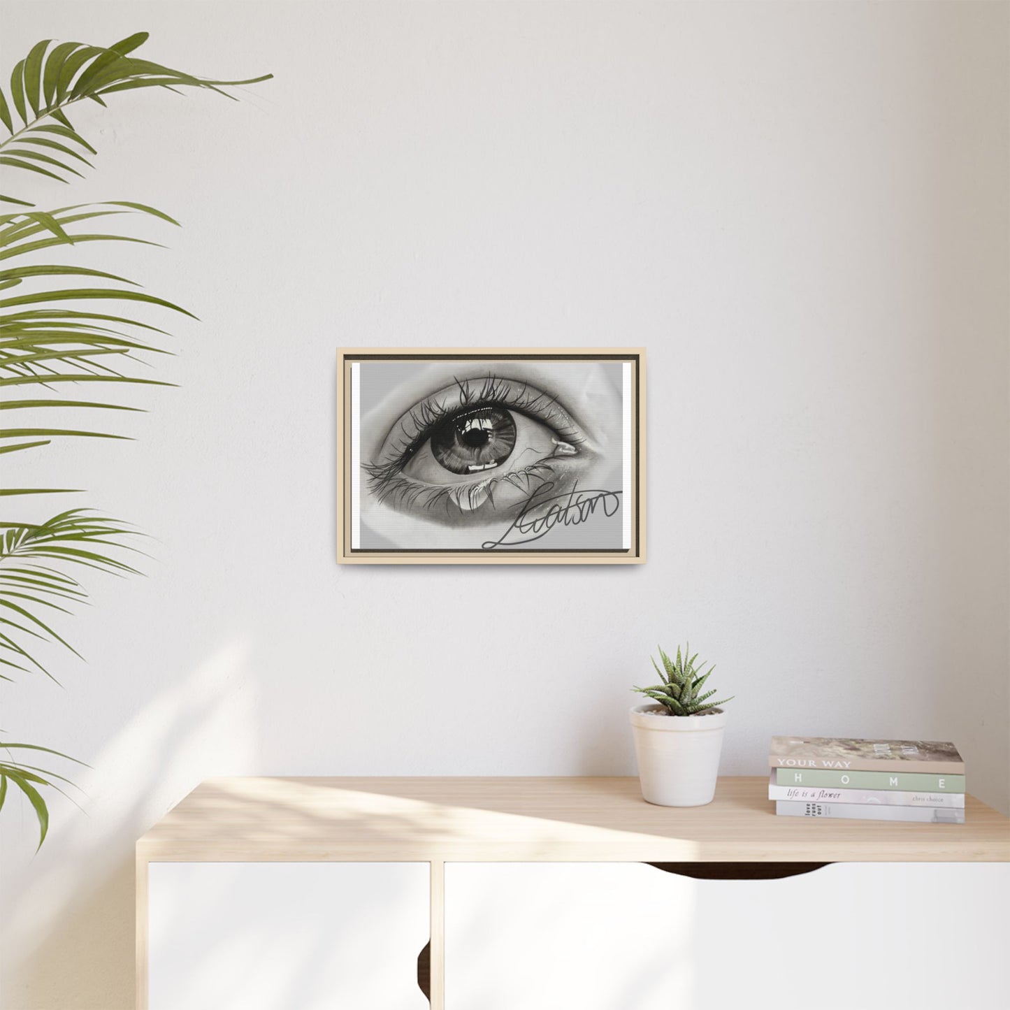 Gerahmte Leinwandkunst – Realistisches Auge mit tränenförmiger Signatur