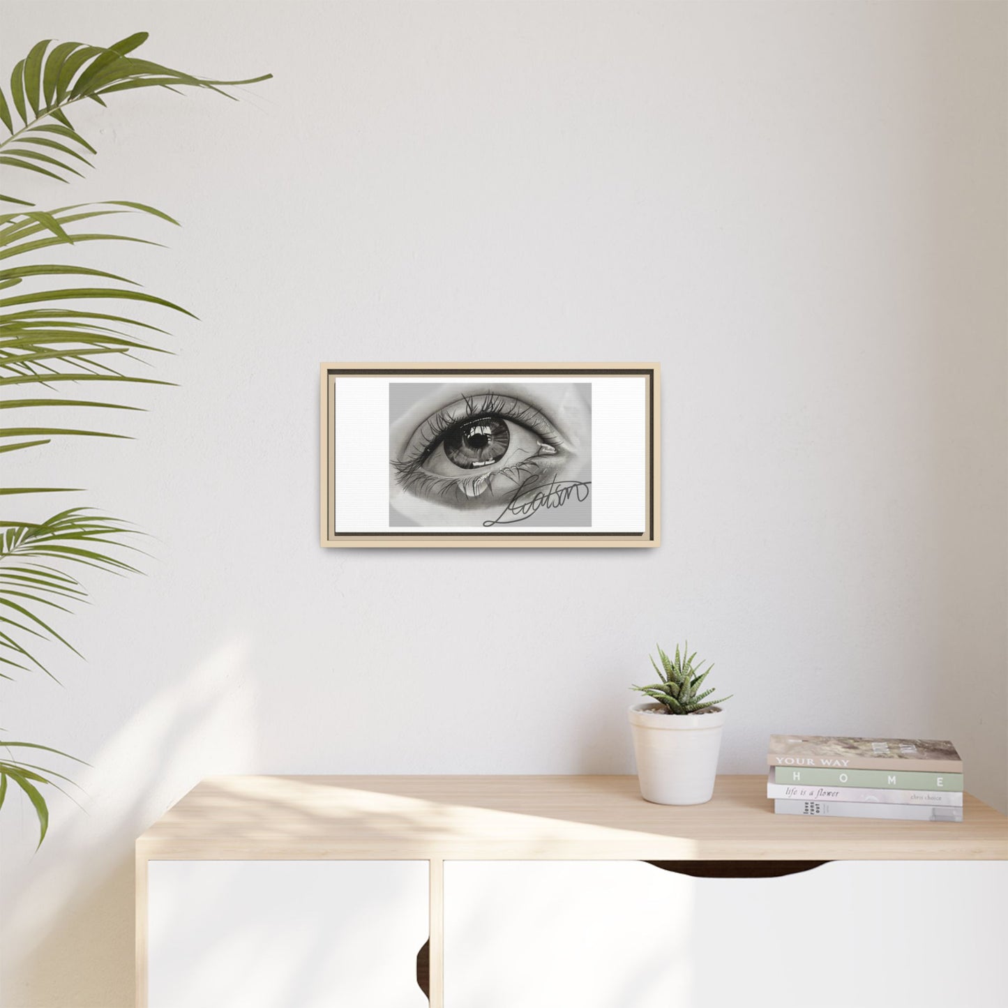 Gerahmte Leinwandkunst – Realistisches Auge mit tränenförmiger Signatur