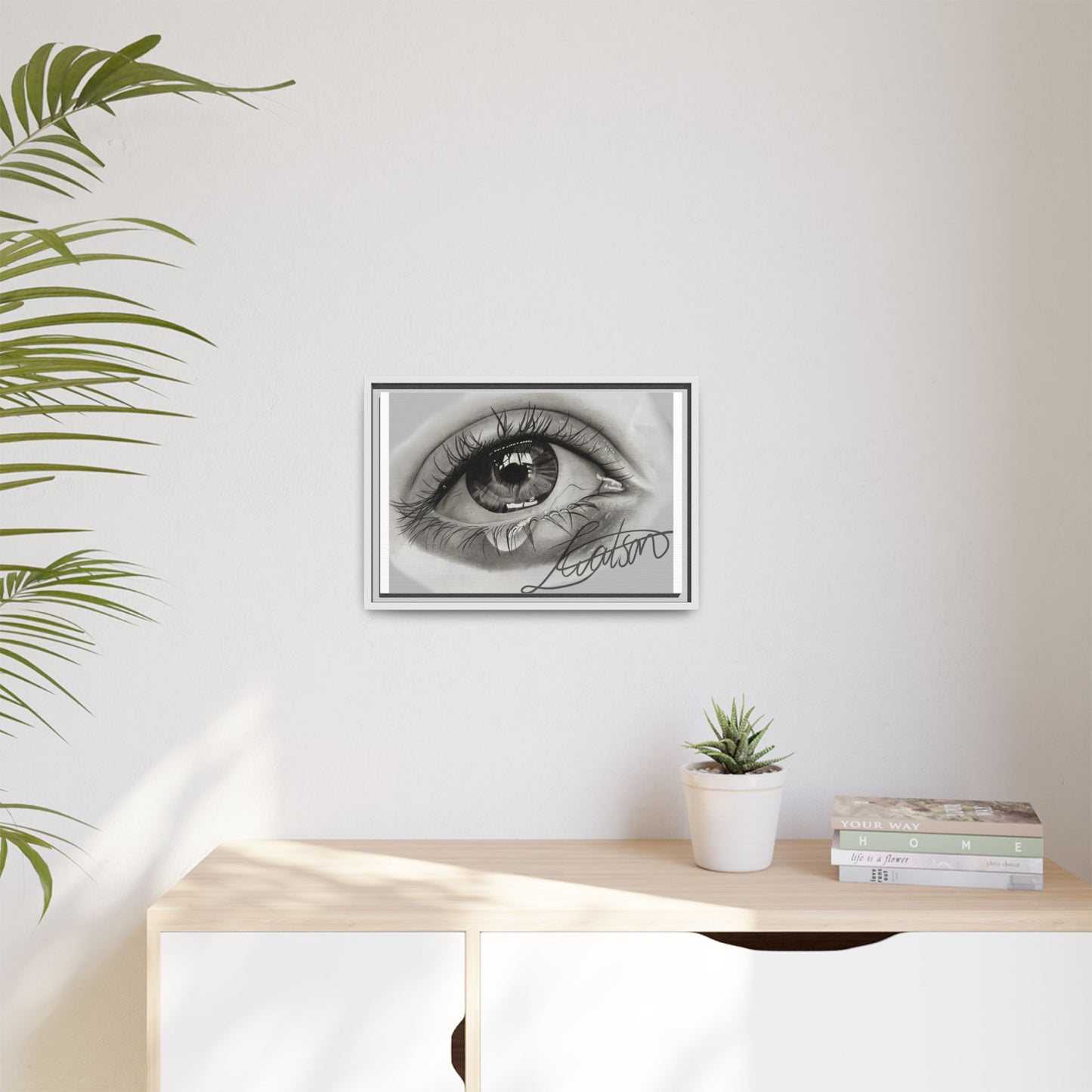 Gerahmte Leinwandkunst – Realistisches Auge mit tränenförmiger Signatur