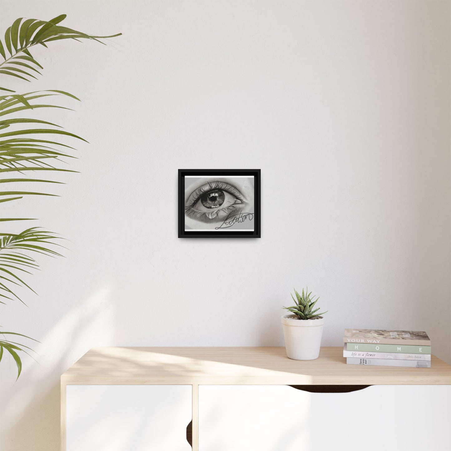 Gerahmte Leinwandkunst – Realistisches Auge mit tränenförmiger Signatur