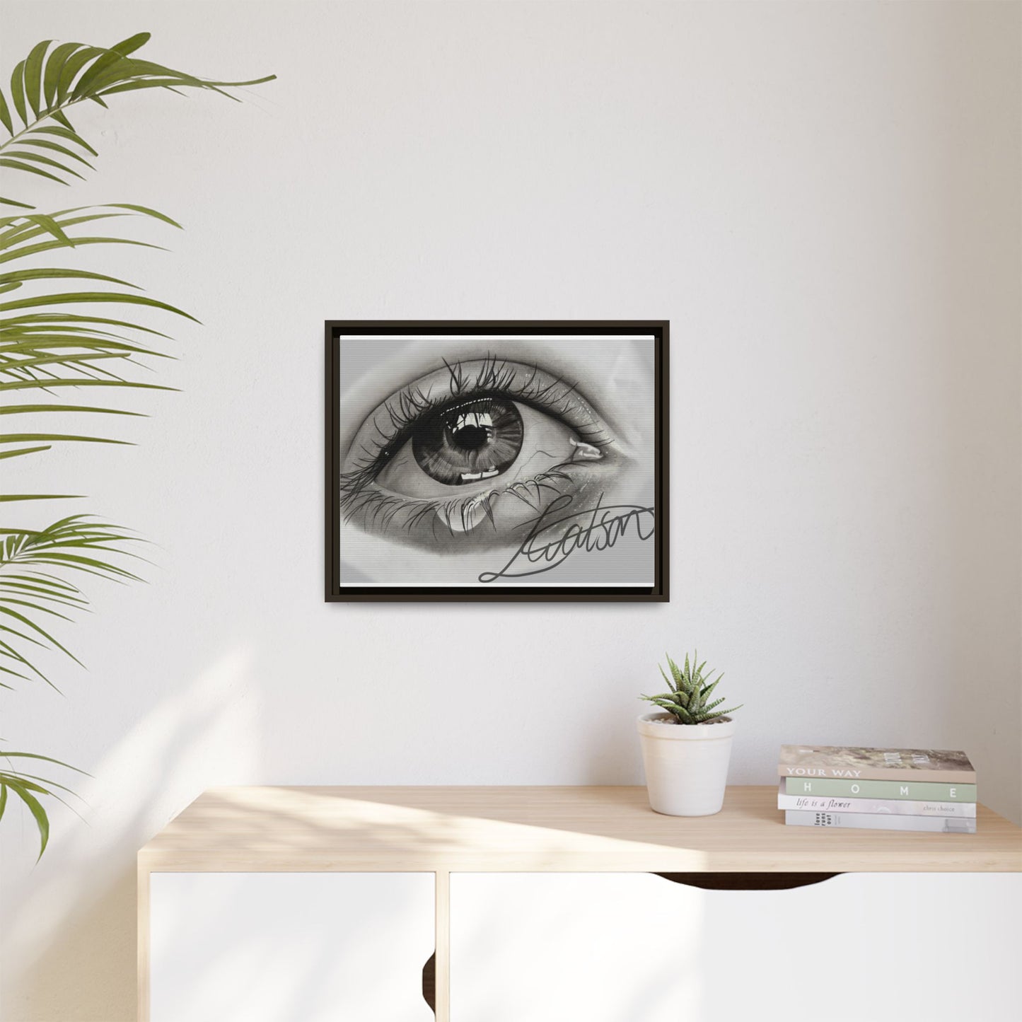 Gerahmte Leinwandkunst – Realistisches Auge mit tränenförmiger Signatur