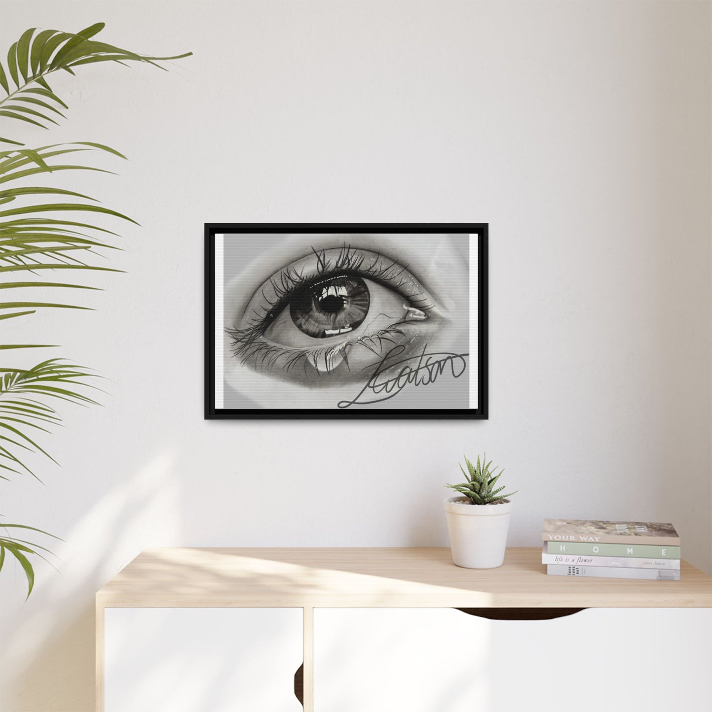 Gerahmte Leinwandkunst – Realistisches Auge mit tränenförmiger Signatur