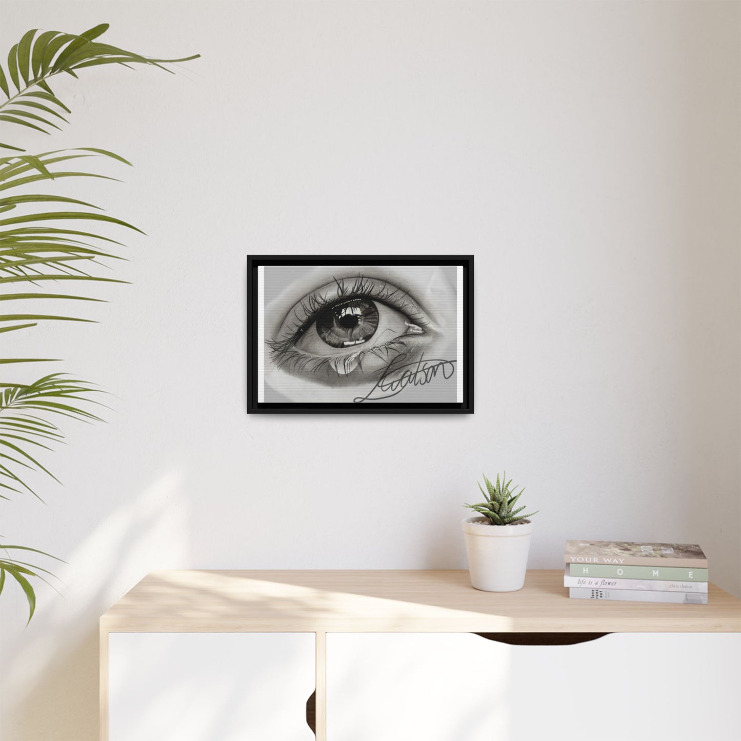 Gerahmte Leinwandkunst – Realistisches Auge mit tränenförmiger Signatur