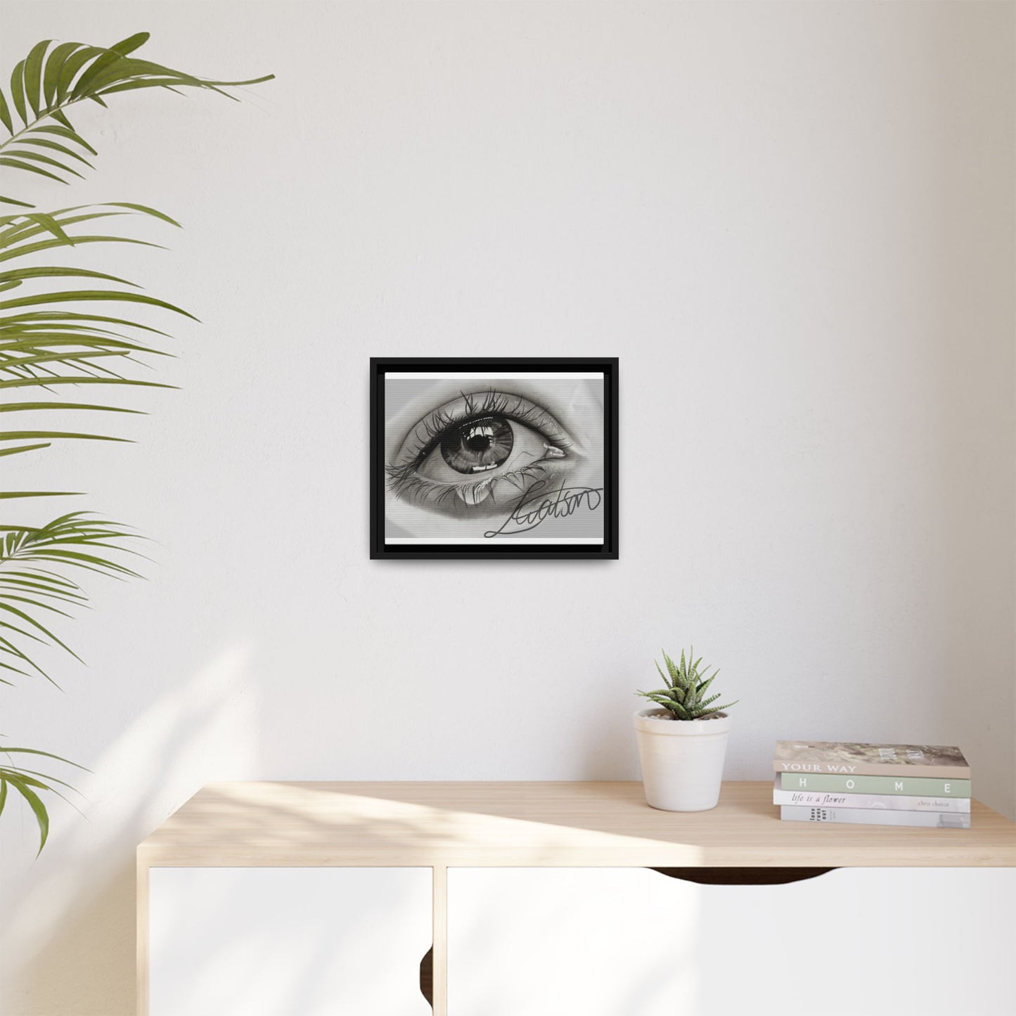 Gerahmte Leinwandkunst – Realistisches Auge mit tränenförmiger Signatur